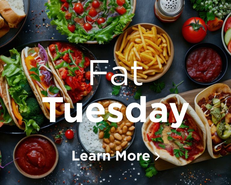 An overview of a large meal on a table. Image links to Fat Tuesday page.